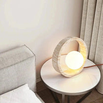 Travertine LED table lamp on a nightstand