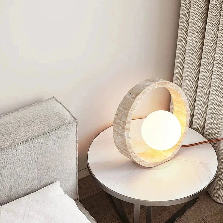 Travertine LED table lamp on a nightstand
