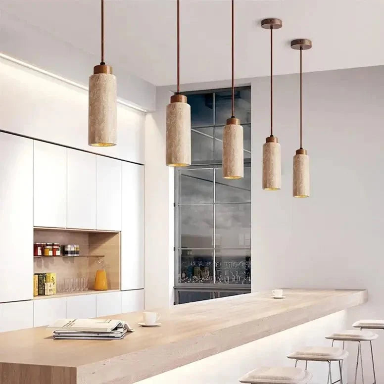 Brio travertine pendant illuminated over a kitchen island