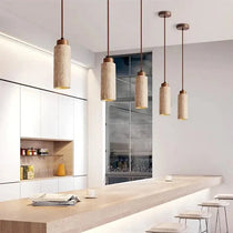 Brio travertine pendant illuminated over a kitchen island
