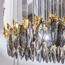 The Legance chandelier by Morsale.com in a bedroom setting, warm-toned smokey crystal fixture.