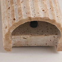 Naples travertine wall sconce mounted on a wall