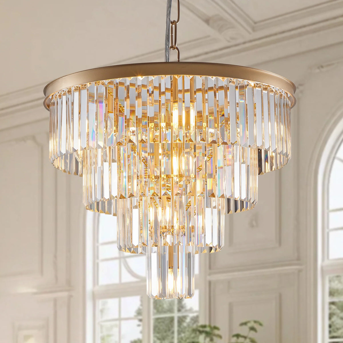 Detail of crystal tiers on the Gio gold chandelier