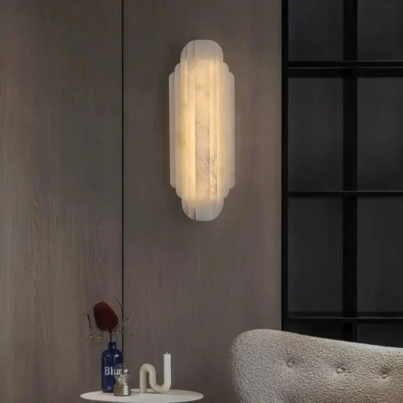 Arina marble wall sconce with glowing natural stone shade Main image