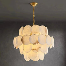Bordwell marble chandelier illuminated over a dining table