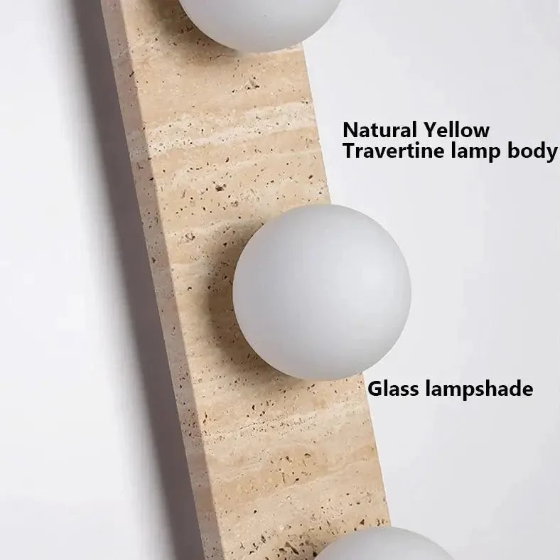 Sonte travertine wall sconce mounted on a wall