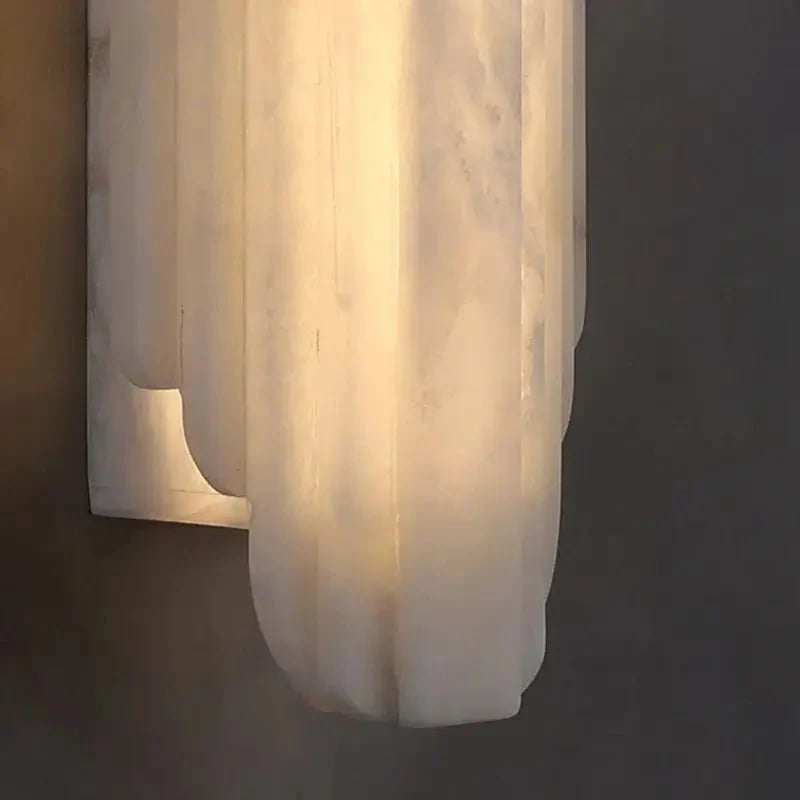 Arina marble sconce warm glow detail