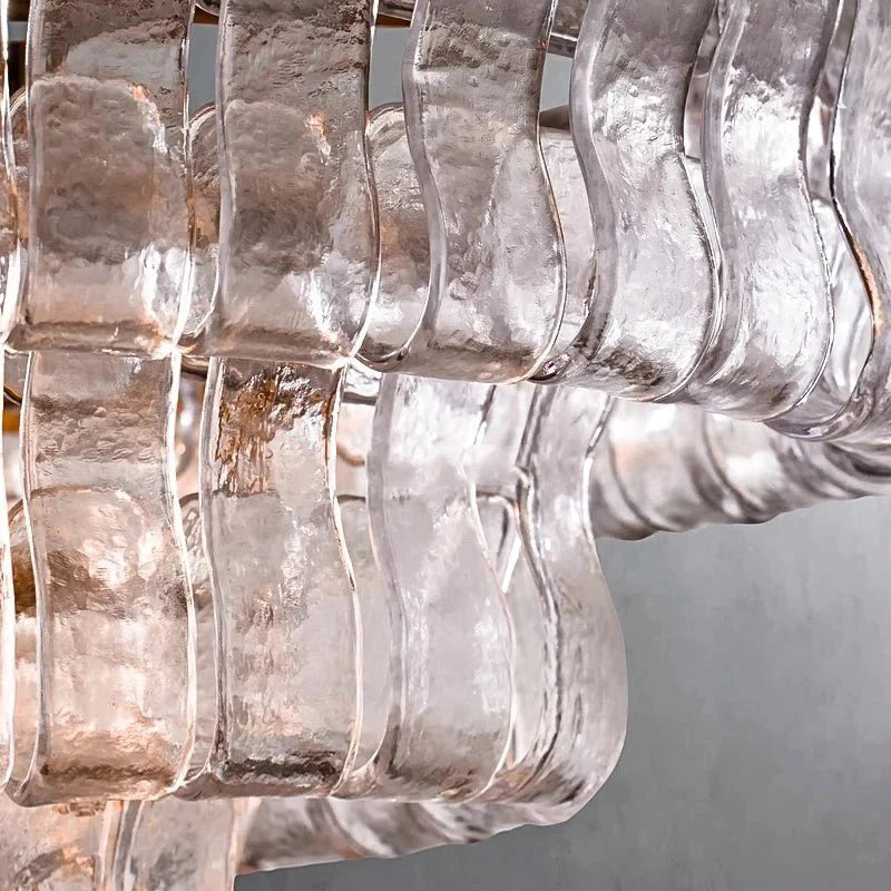 Detail of curved clear glass panels on the Riviera chandelier