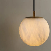 Horrin marble ball wall sconce mounted on a wall