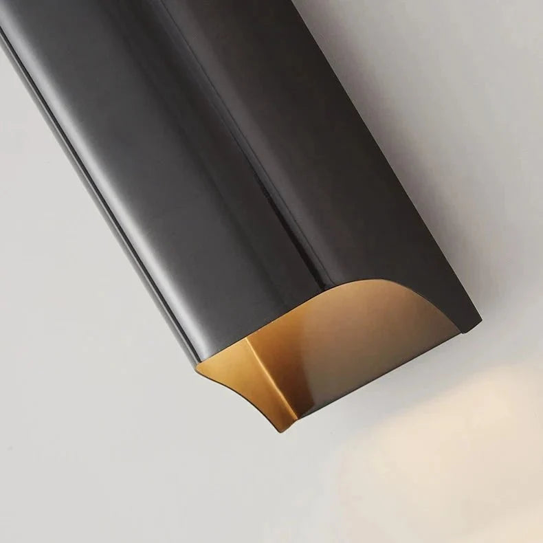 Pair of Rame copper wall sconces framing a living room wall