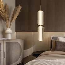 Lareno glass pendant casting soft light in a reading corner