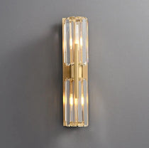Detail of faceted crystal shades on the Gio brass sconce