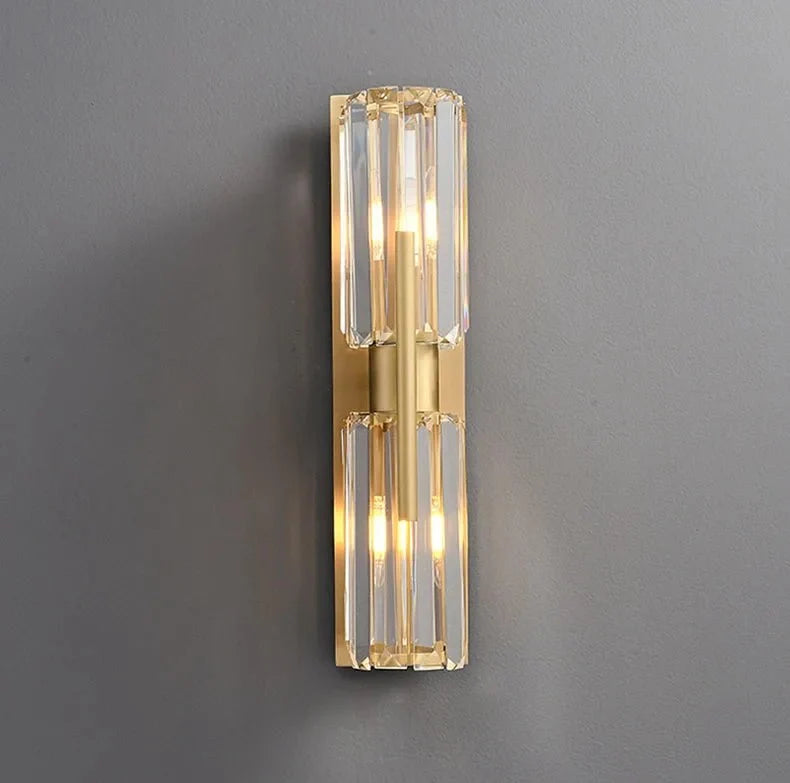 Detail of faceted crystal shades on the Gio brass sconce