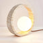 Modern travertine LED table lamp on a desk