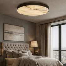 Laurel marble flush mount glowing on a ceiling