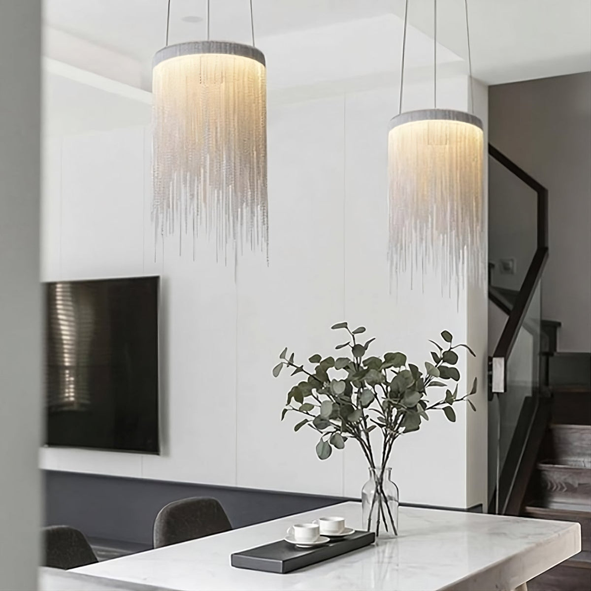 The Cadena chain tassel pendant from Morsale.com above a kitchen counter, cascading metal tassels with integrated 3000K LED.