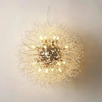 The El Sol crystal dandelion from Morsale.com reflecting colorful light around the room, clear crystals on a steel frame.