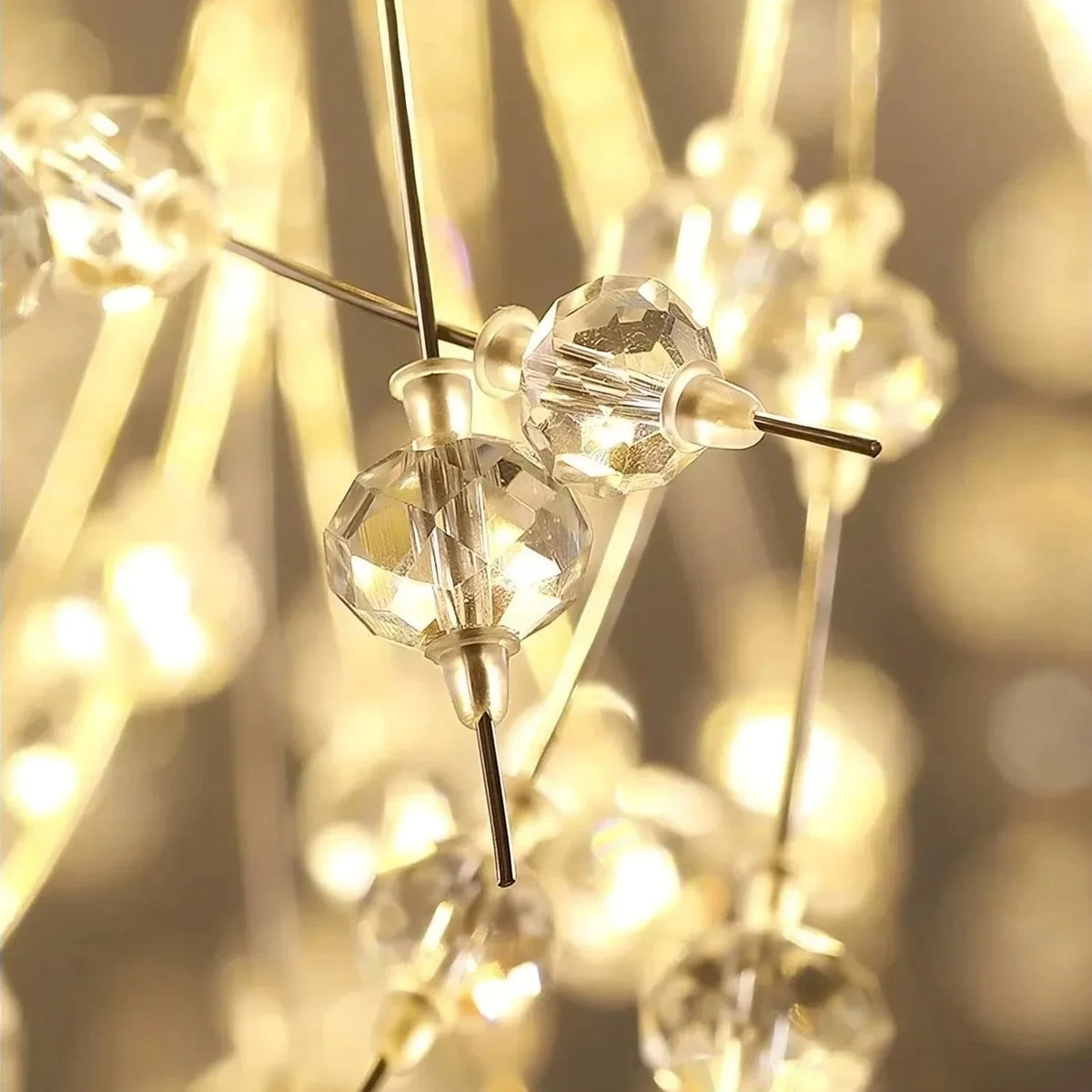 The El Sol dandelion chandelier by Morsale.com in a gold finish, clear crystal tips catching warm G9 LED light.