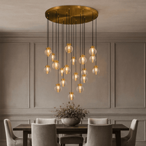 Bossen 19-globe chandelier illuminated over a dining table