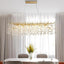 Albero gold crystal dining chandelier over a large dining table