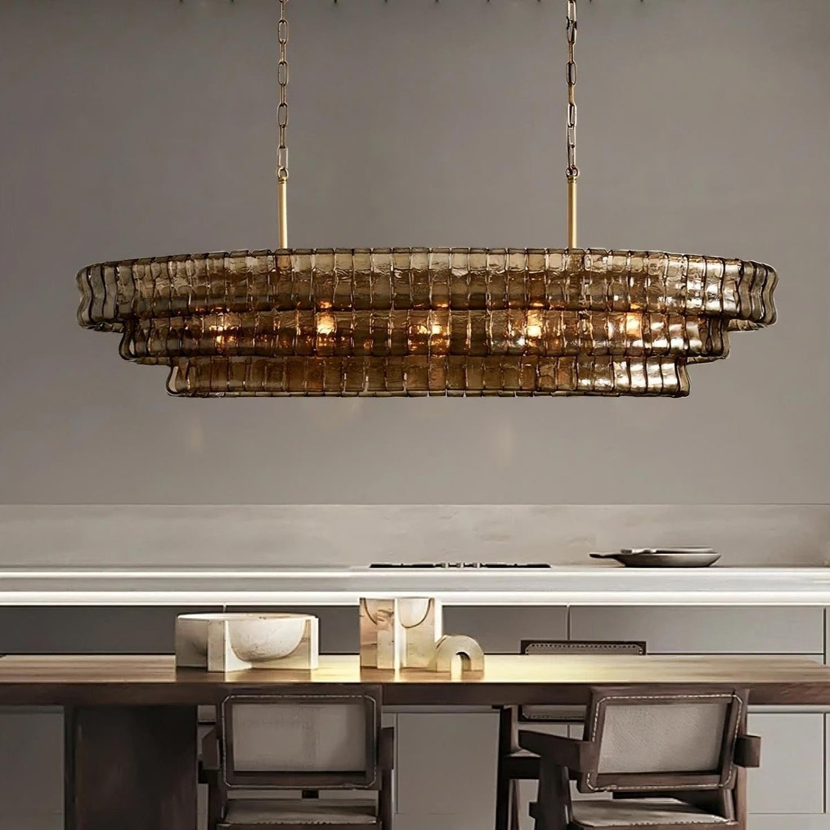 Riviera oval smoke glass chandelier over a dining table Main image