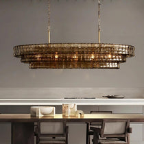 Riviera oval smoke glass chandelier over a dining table