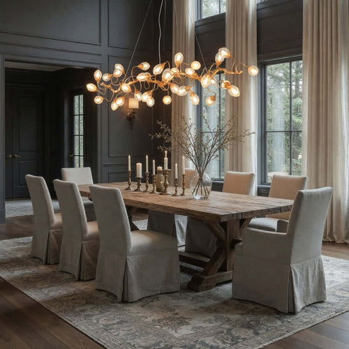 Albero brass branch chandelier over a dining table