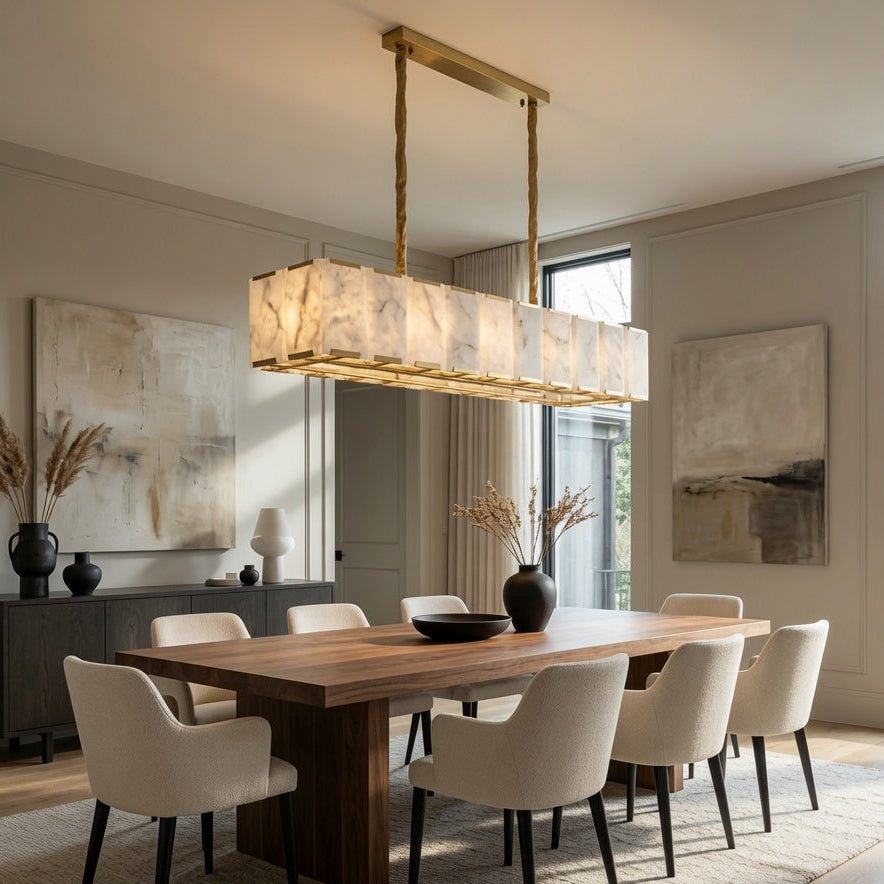 Modern dining room with wooden table, white chairs, and a pendant light. Main image