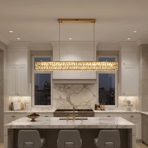 Bacci gold crystal linear dining chandelier over a long table