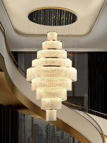 Alleri crystal staircase chandelier filling a double-height entryway