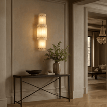 Valmont marble wall sconce mounted on a wall