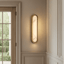 Solari natural marble and brass wall sconce full view