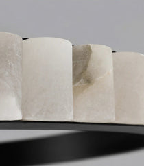 Hampton marble chandelier warm glow through natural stone