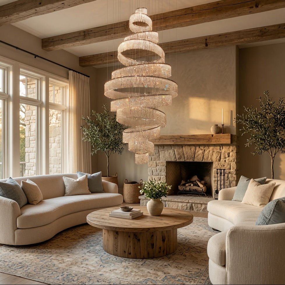 Modern living room with spiral chandelier, beige sofas, and a stone fireplace.