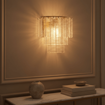 Palermo glass and crystal wall sconce above a console