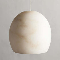 Auris marble chandelier warm glow through stone shades
