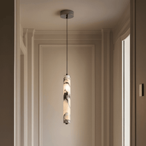 Valmont marble pendant illuminated over a kitchen island