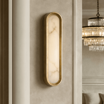Solari marble sconce illuminated with a warm glow