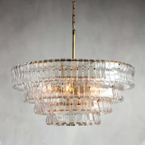 Riviera modern chandelier illuminated over a dining table