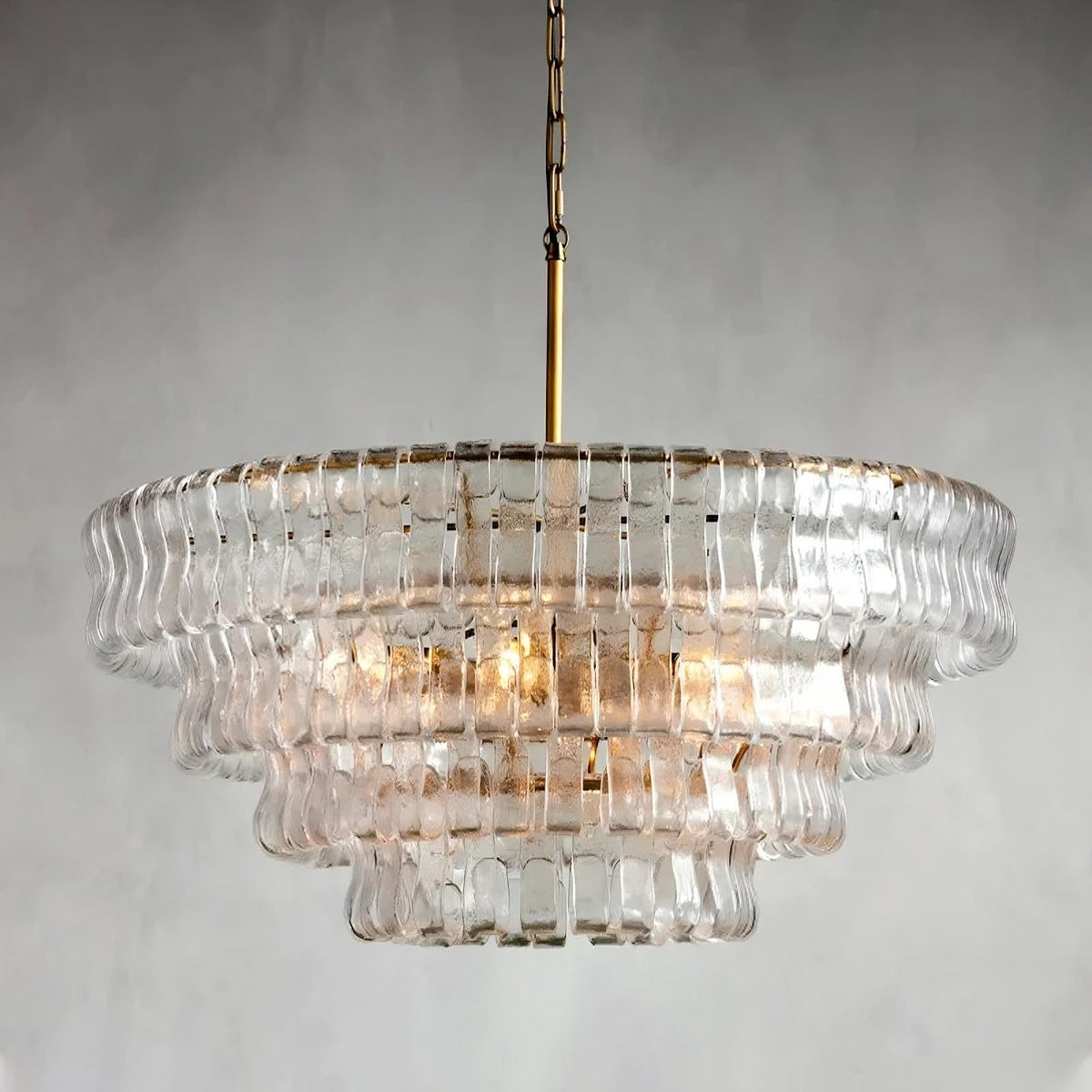 Riviera modern chandelier illuminated over a dining table
