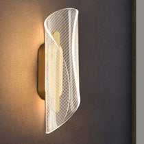 Lamina modern LED wall sconce with frosted acrylic diffuser in a living room