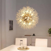 El Sol crystal dandelion lighting fixture by Morsale.com, a 23-inch sphere of clear crystal-tipped arms on a stainless steel frame above a dining table.