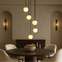Brighton marble chandelier illuminated over a dining table