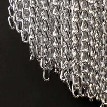 Cadena tassel wall sconce illuminated beside a bed