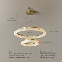 Bergamo crystal chandelier illuminated over a dining table