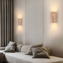 Naples travertine sconce with warm glowing stone shade