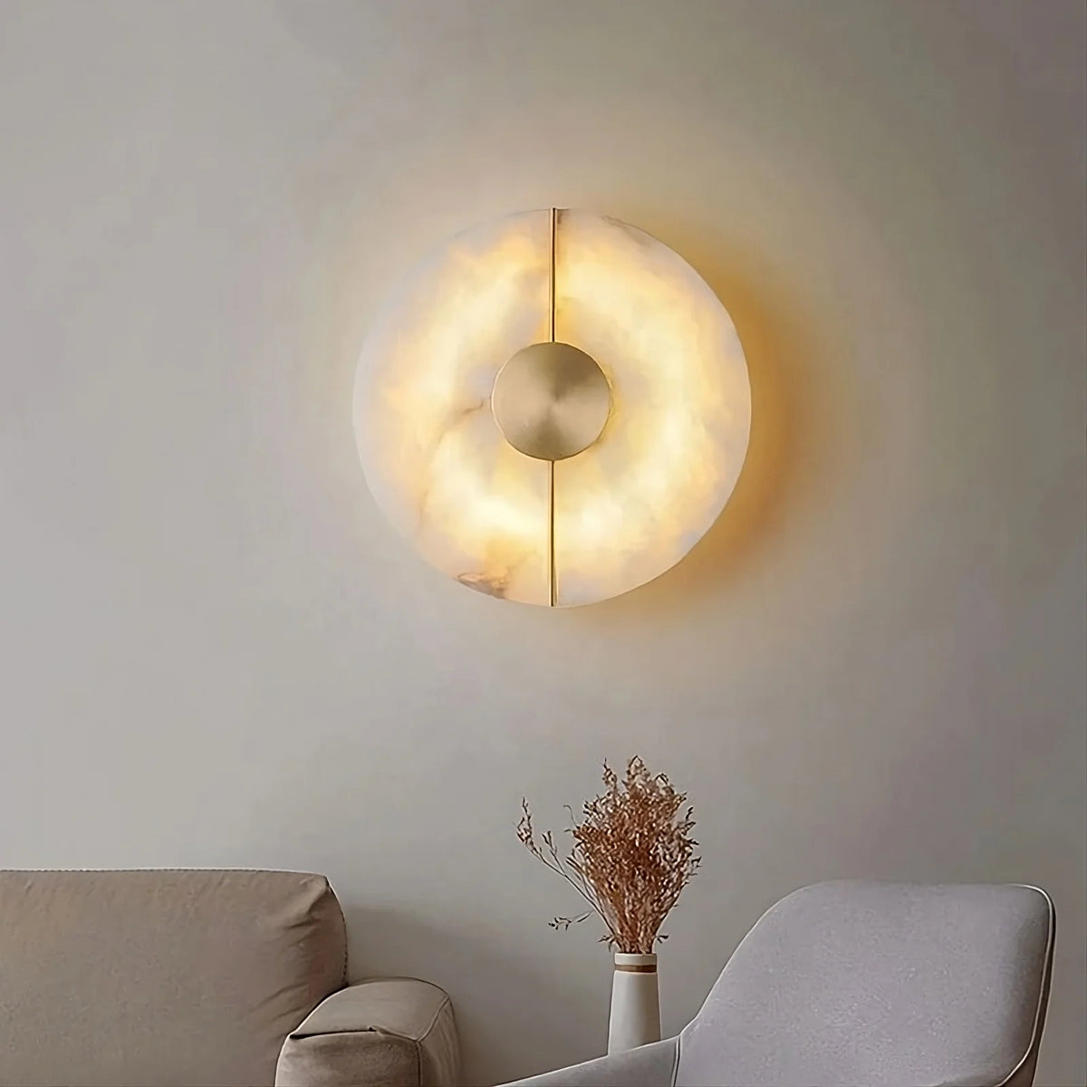 Altura hand-carved marble disc wall sconce with brass inlay Main image