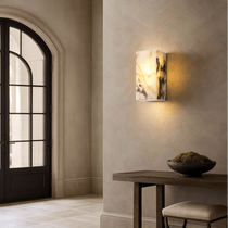 Arden wall light with glowing marble shade on a steel frame