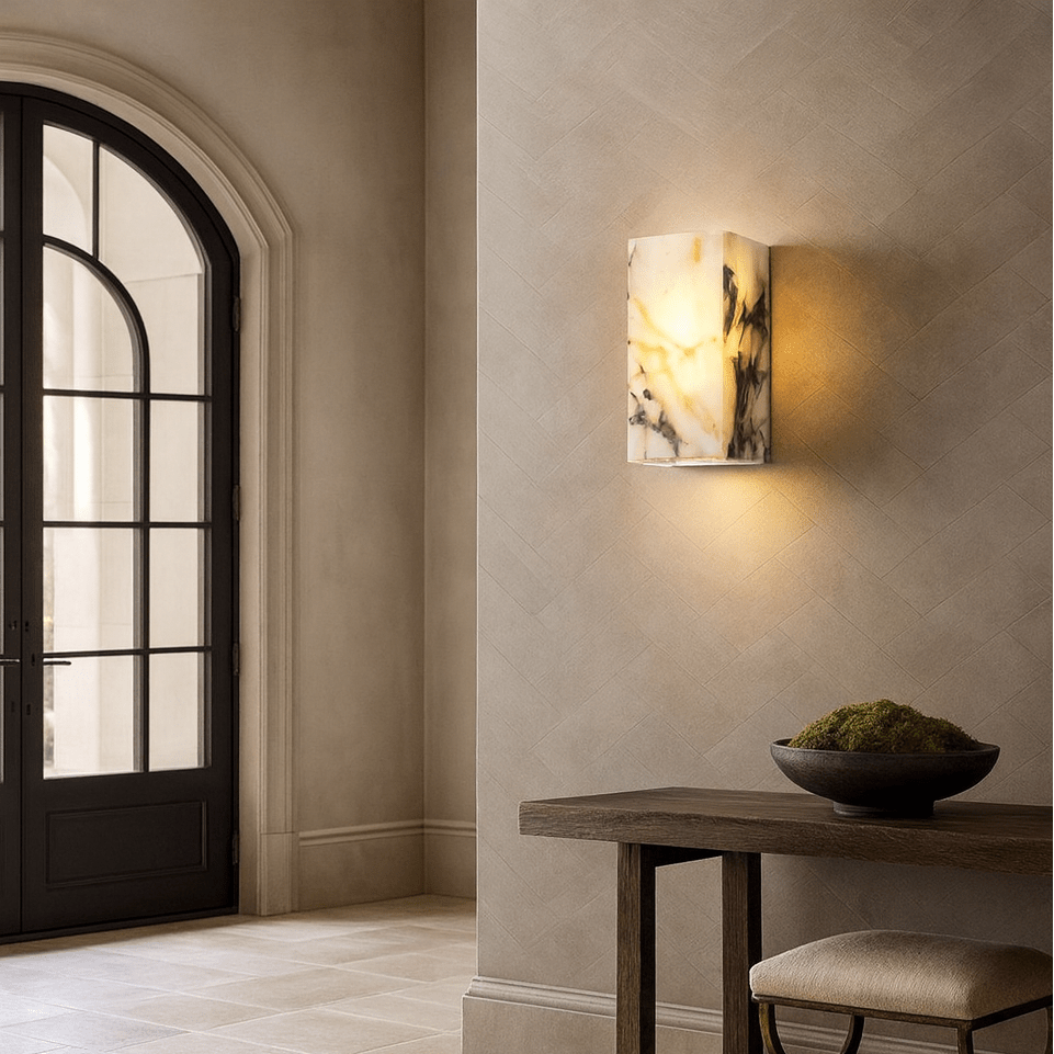 Arden wall light with glowing marble shade on a steel frame