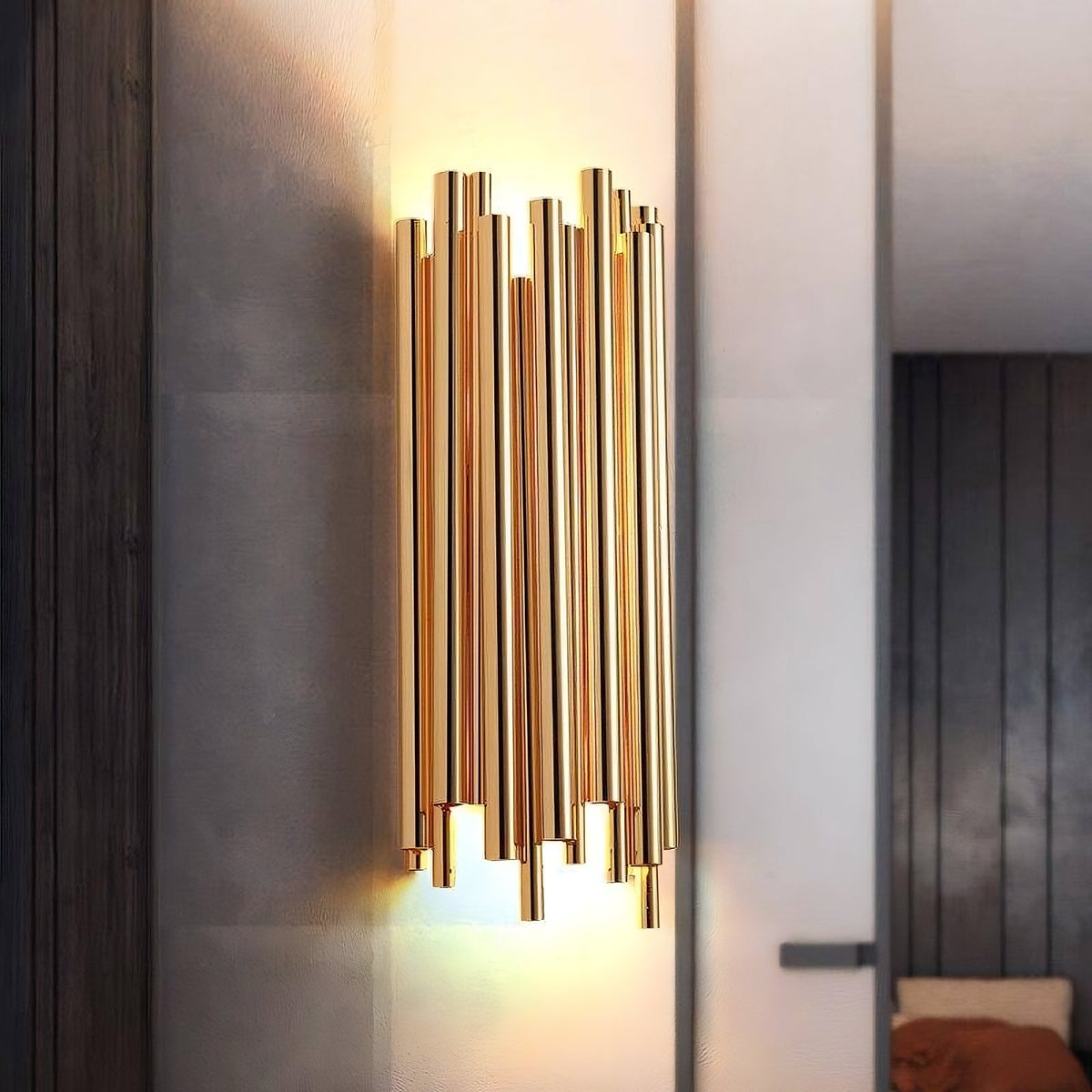 Vigo stainless steel wall sconce by Morsale.com, slender polished steel rods rising from a compact backplate with warm G9 LED light. Main image